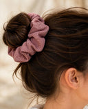 Close-up of the Mauve Rose kimono scrunchie worn on a messy bun