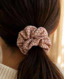 Close-up of the Red Net Lattice kimono scrunchie worn on a low ponytail