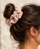 Close-up of the Red Net Lattice kimono scrunchie worn on a messy bun