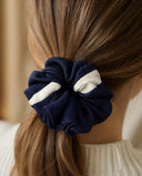 Close-up of the Navy & White Stripe kimono scrunchie worn on a low ponytail