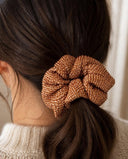 Close-up of the Copper Shibori kimono scrunchie worn on a low ponytail