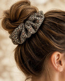 Close-up of the Black & Beige Lattice kimono scrunchie worn on a messy bun