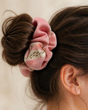 Close-up of the Rose Pink Floral kimono scrunchie worn on a messy bun