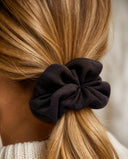 Close-up of the Dark Chocolate kimono scrunchie worn on a low ponytail