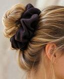 Close-up of the Dark Chocolate kimono scrunchie worn on a messy bun