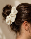 Close-up of the Ivory Silk kimono scrunchie worn on a messy bun