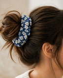 Close-up of the Blue & White Blossom kimono scrunchie worn on a messy bun