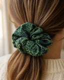 Close-up of the Green Floral Line kimono scrunchie worn on a low ponytail