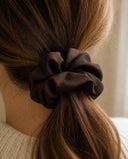 Close-up of the Coffee Brown kimono scrunchie worn on a low ponytail