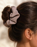 Close-up of the Mocha Taupe kimono scrunchie worn on a messy bun