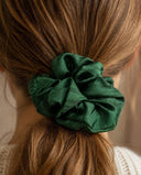 Close-up of the Forest Green kimono scrunchie worn on a low ponytail