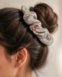 Close-up of the Ivory Ink Botanical kimono scrunchie worn on a messy bun