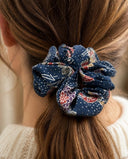 Close-up of the Navy & Pink Floral kimono scrunchie worn on a low ponytail