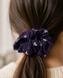 Close-up of the Purple Small Blossom kimono scrunchie worn on a low ponytail