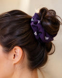Close-up of the Purple Small Blossom kimono scrunchie worn on a messy bun