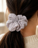 Close-up of the White & Black Dot kimono scrunchie worn on a low ponytail
