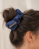 Close-up of the Denim Blue kimono scrunchie worn on a messy bun