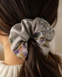 Close-up of the Silver Gray Floral kimono scrunchie worn on a low ponytail