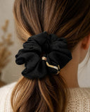 Close-up of the Black Gold Fleck kimono scrunchie worn on a low ponytail