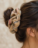 Close-up of the Olive Gold Brocade kimono scrunchie worn on a messy bun