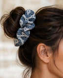 Close-up of the Slate Blue Fan kimono scrunchie worn on a messy bun