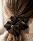 Close-up of the Dark Brown & Gold kimono scrunchie worn on a low ponytail