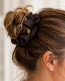 Close-up of the Dark Brown & Gold kimono scrunchie worn on a messy bun