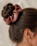 Close-up of the Rosewood Floral Accent kimono scrunchie worn on a messy bun