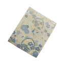 Blue Hanamaru Karakusa Ed. 04 Kimono Pocket T-Shirt with a pocket of vintage Nishijin-ori kimono silk, with blue flower roundels and golden scrolling vines