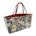 Crest Collage obi bag made from a vintage Japanese obi, with scattered crests, plum blossoms, pine roundels and zigzag panels, view 2