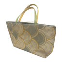Gilded Seigaiha obi bag made from a vintage Japanese obi, with overlapping gold and grey green seigaiha arches