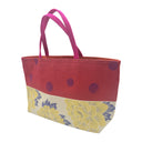 Peony Polka obi bag made from a vintage Japanese obi, with yellow peonies and blue leaves beside a red band of dark polka dots