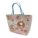 Petal Roundels obi bag made from a vintage Japanese obi, with flower roundels and scattered blossoms over a herringbone pattern on blush