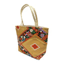 Phoenix Garden obi bag made from a vintage Japanese obi, with a phoenix and flowers flowing between golden diamonds