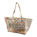 Phoenix Lattice obi bag made from a vintage Japanese obi, with phoenixes and flower roundels inside a diamond lattice on champagne, view 3