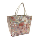 Rosewood Wheels obi bag made from a vintage Japanese obi, with lattice roundels tied with red cords, carriage wheels and flowers on dusty rose, view 2