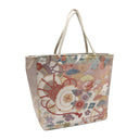 Rosewood Wheels obi bag made from a vintage Japanese obi, with lattice roundels tied with red cords, carriage wheels and flowers on dusty rose, view 4