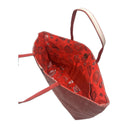 Ruby Trail obi bag made from a vintage Japanese obi, with a band of dark diamonds and a wavy beige line on textured red, view 5